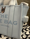 Marc Jacobs pale blue bag featuring Coco the Chihuahua