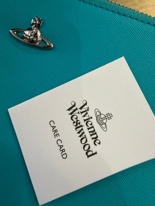 Vivienne Westwood turquoise wristlet- clutch