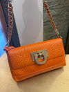 DKNY printed leather orange handbag/clutch