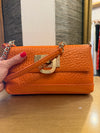 DKNY printed leather orange handbag/clutch
