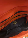 DKNY printed leather orange handbag/clutch